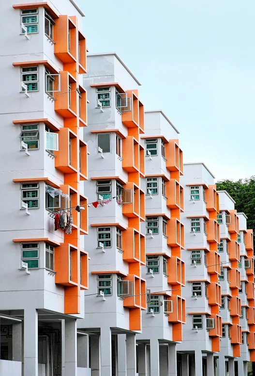 there are many orange windows on the front of this building