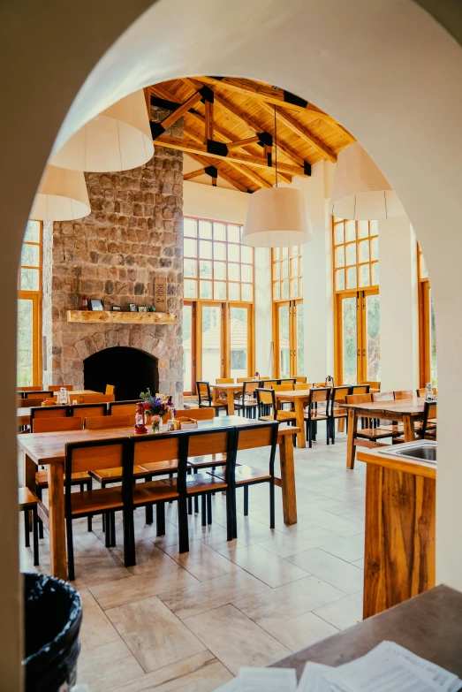 a dining room with tables and windows filled with lights