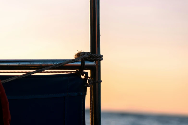 there is an orange and black object on a boat