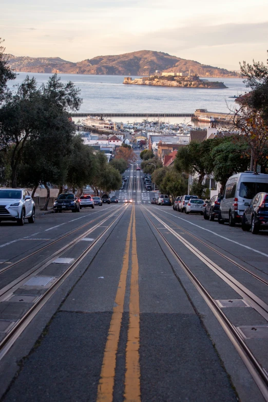 a city street with cars parked on the side