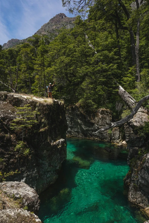 there are many people that are standing on the rocks