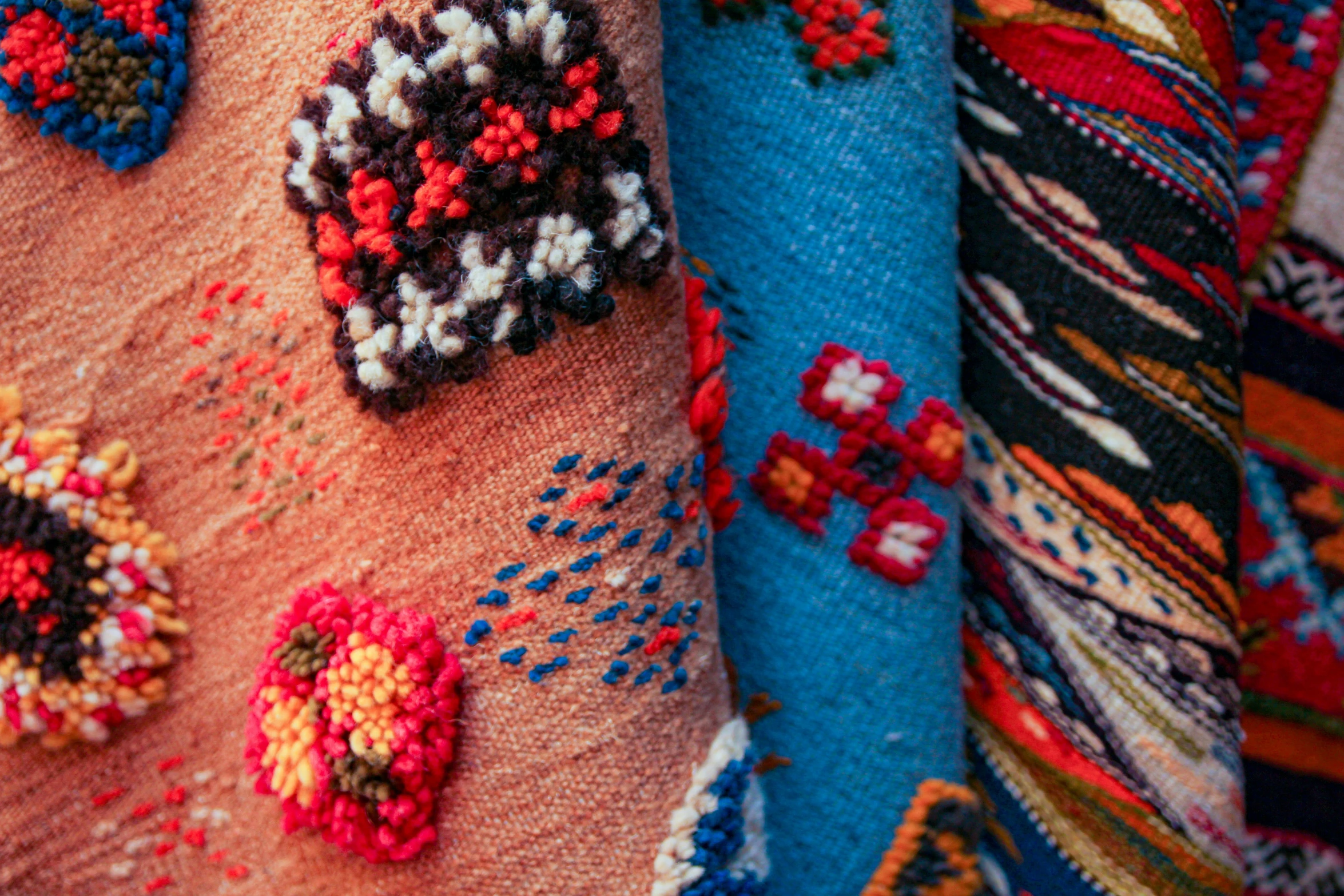 a close up of knit fabrics with designs on them