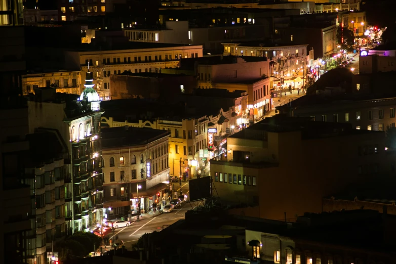 a city with tall buildings at night in the background