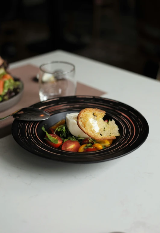 a bowl with some food on a plate