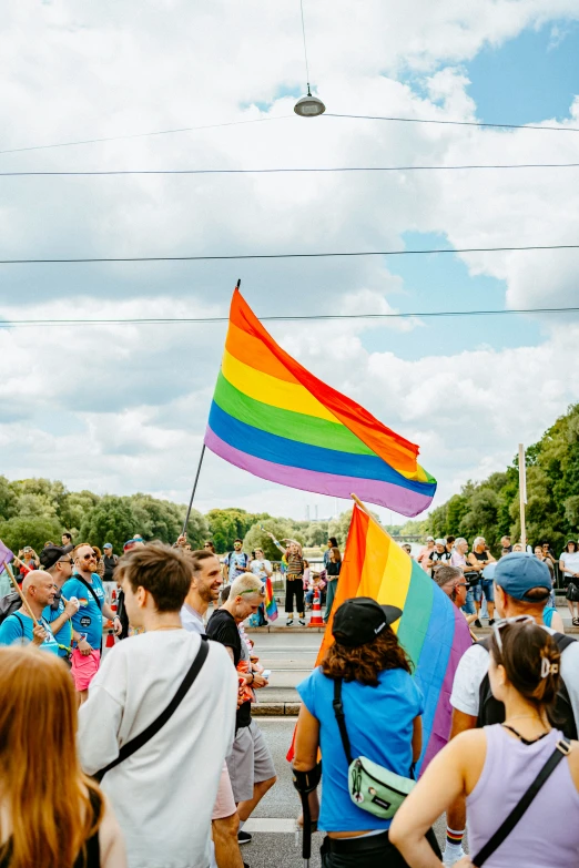 a crowd of people with one holding a flag