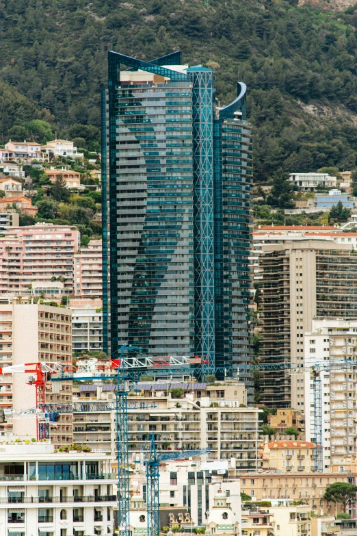 a large tall building surrounded by lots of buildings