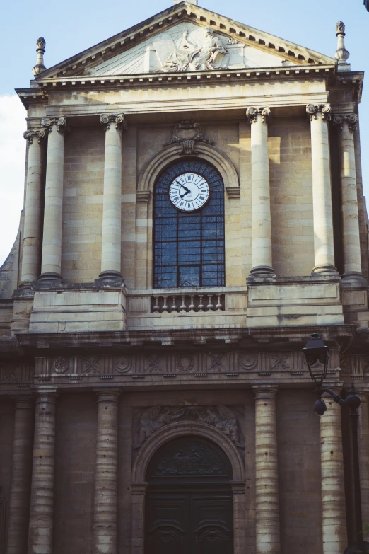 an old building has a clock on it