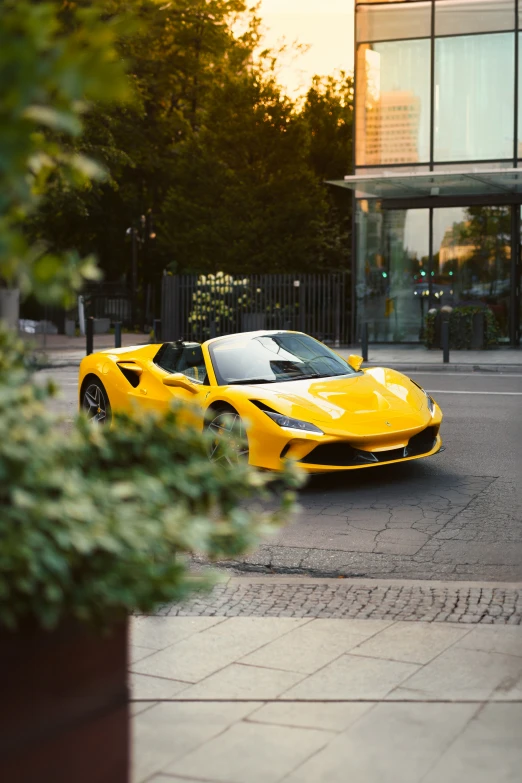 a yellow car is parked in front of a building