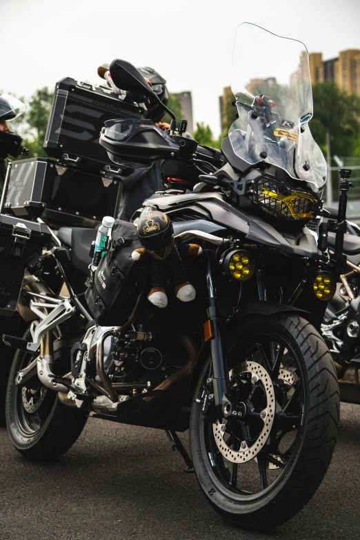 three motorcycles parked side by side on asphalt