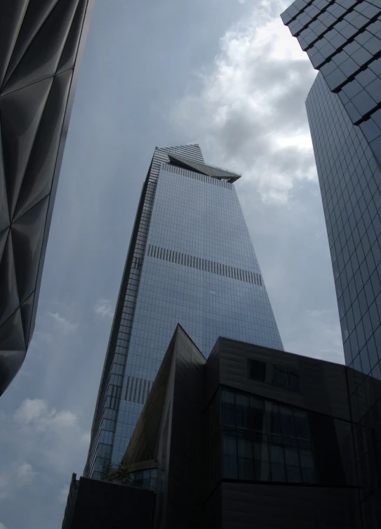 several tall buildings in a city, with some very tall windows