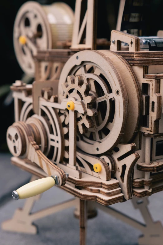 a clock is shown with yellow eyes and some wheels