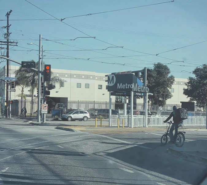 a person riding a bicycle down a street