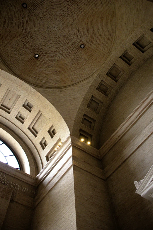 a view up through an arch at a building