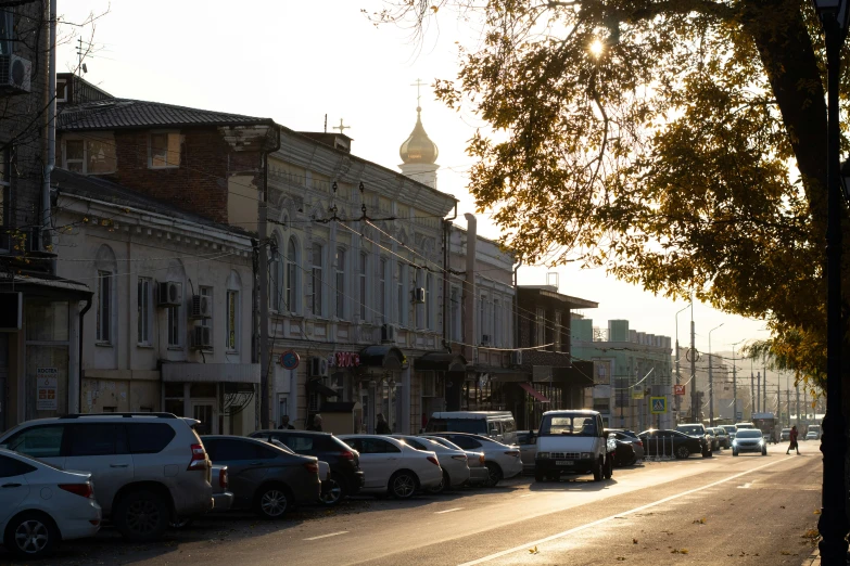 many cars are parked on a city street