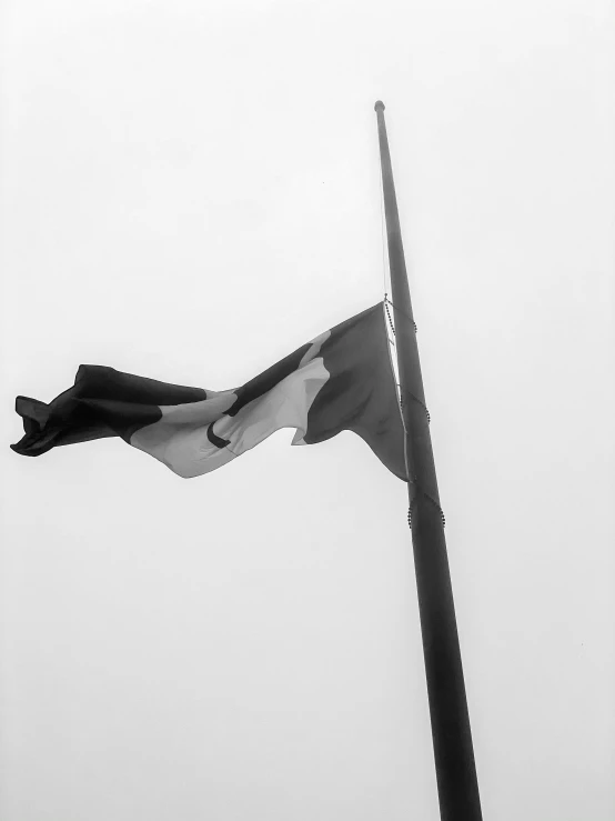 an image of the flag waving high in the sky