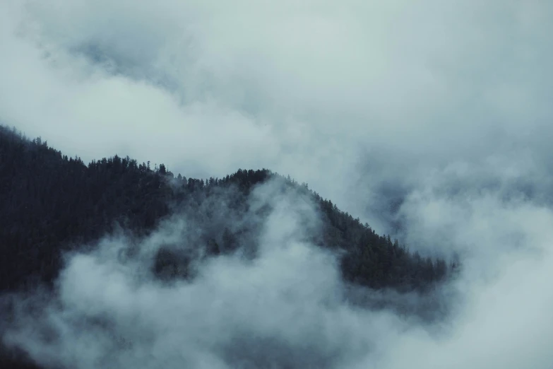 the po is taken of mountains with fog in the valley