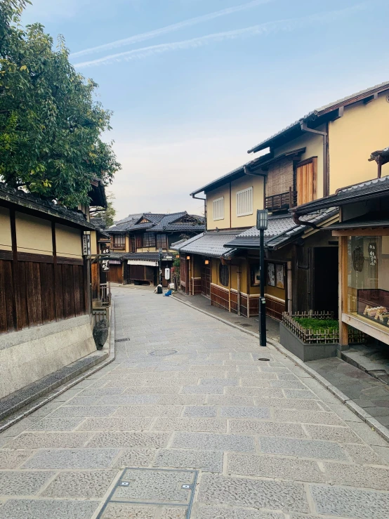 a small alley is lined with old buildings