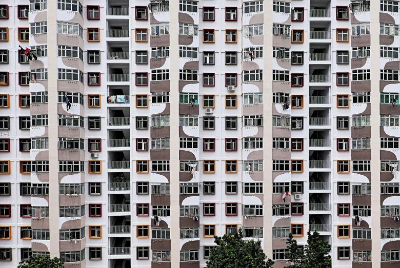 tall white and orange building with several windows