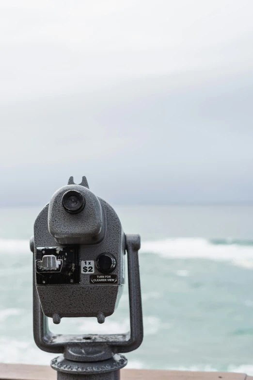 the top part of a camera facing a body of water