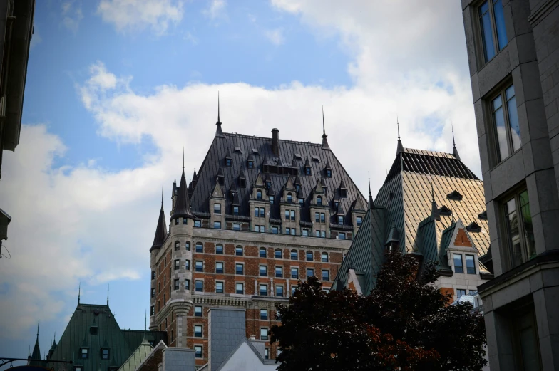 a very tall building surrounded by buildings