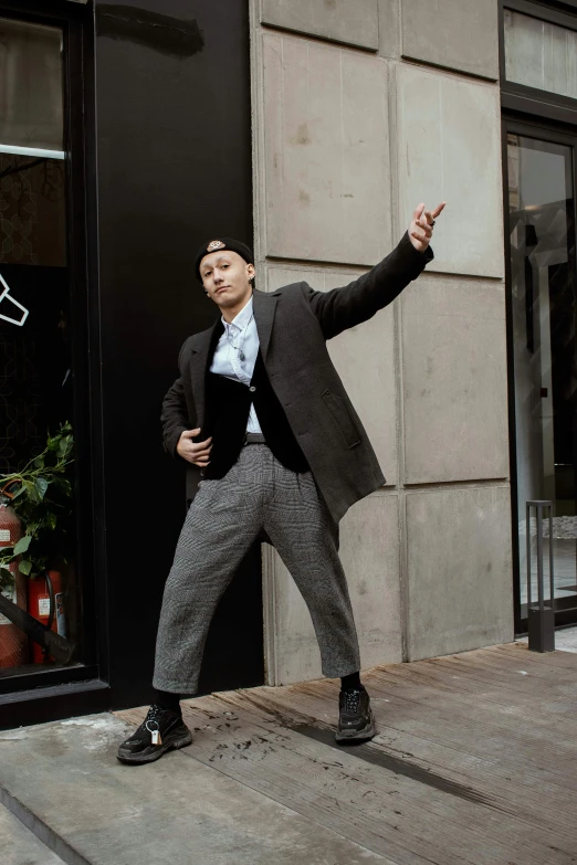 a man poses in front of an open store