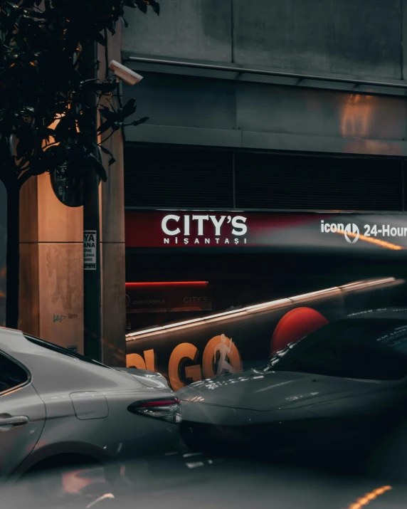 cars parked on the sidewalk in front of buildings