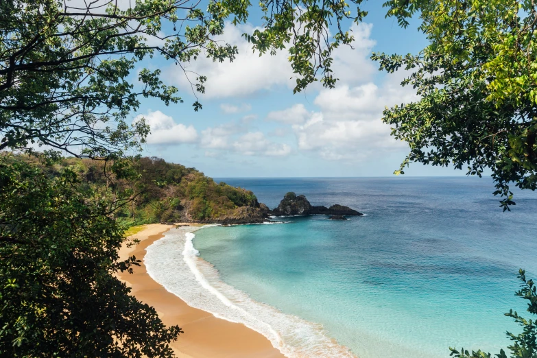 a beautiful view looking out over the water to the beach