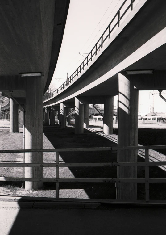 the underside of two overpasss are shown in black and white