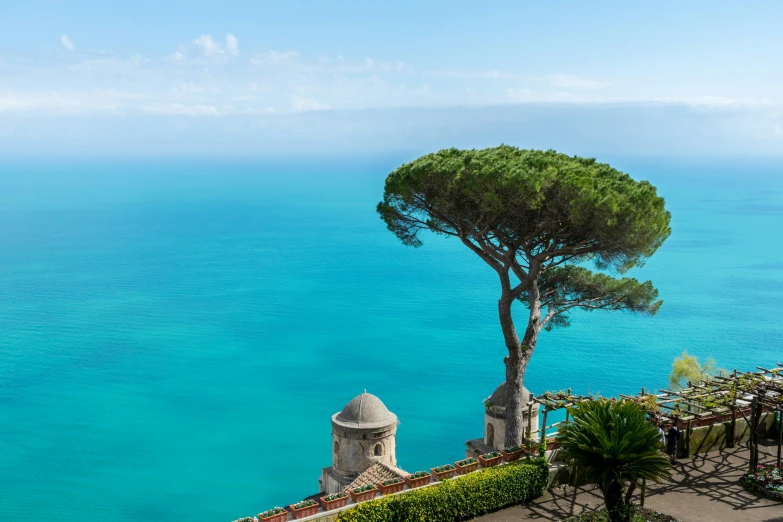 the view from a balcony at a resort by the ocean