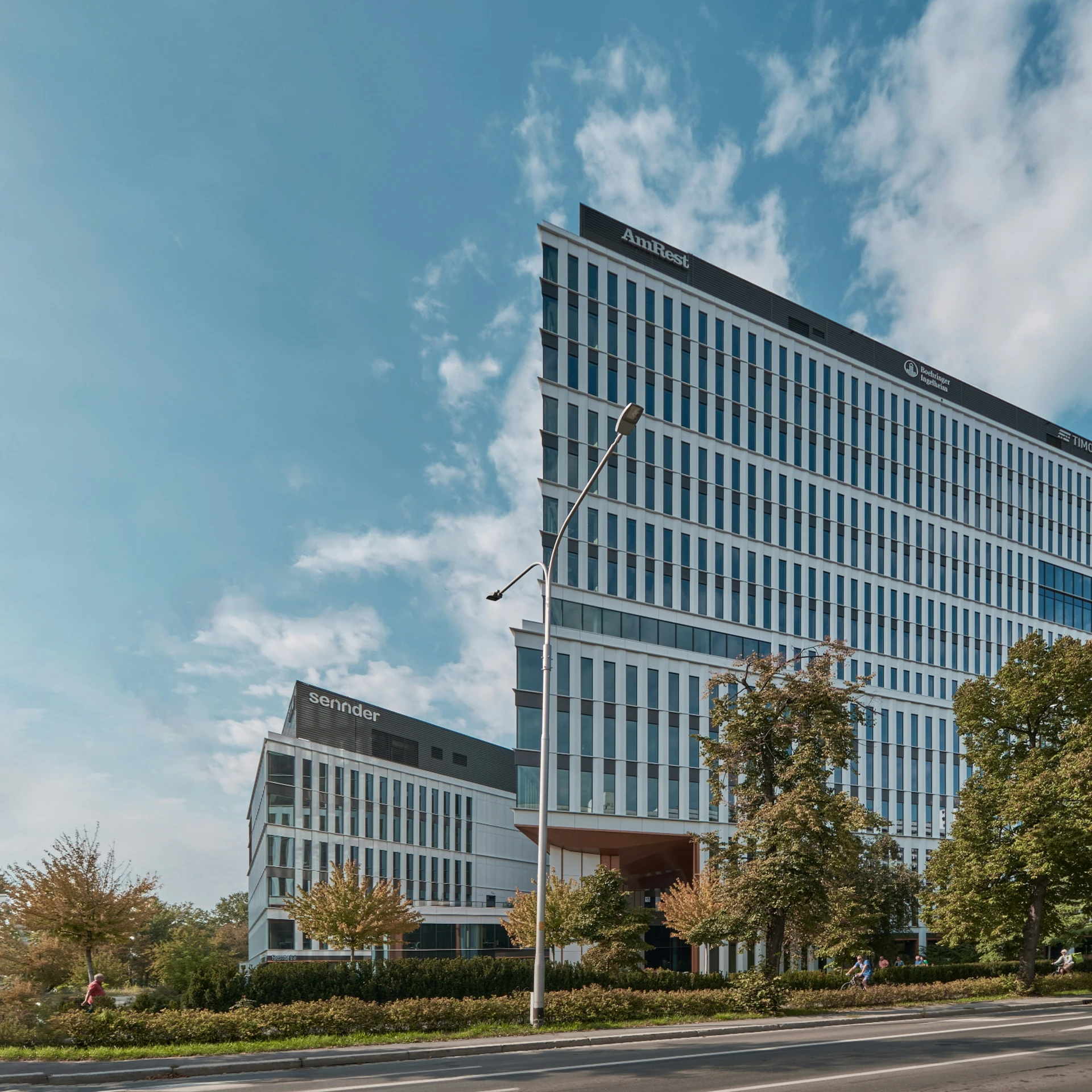 a view of an office building on the corner of a street