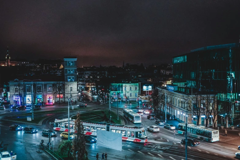 a dark city with many traffic on the street at night