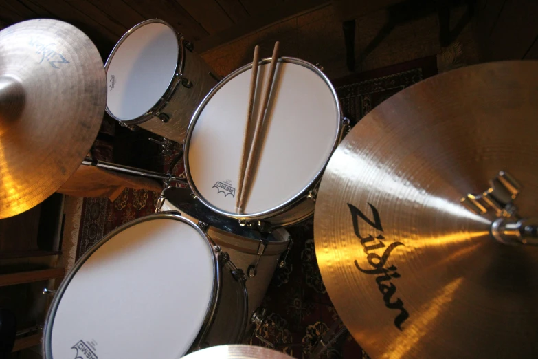 a drummers set up and ready to play a musical instrument