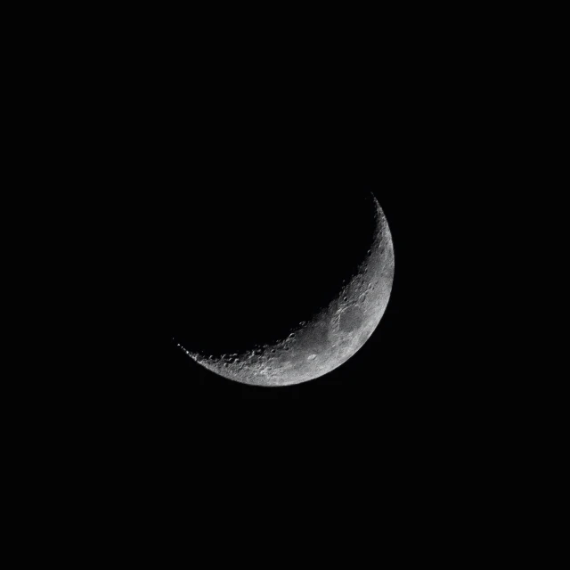 a close up of a half - moon in the sky