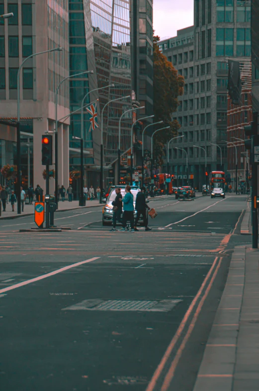 a couple of people walking down a street