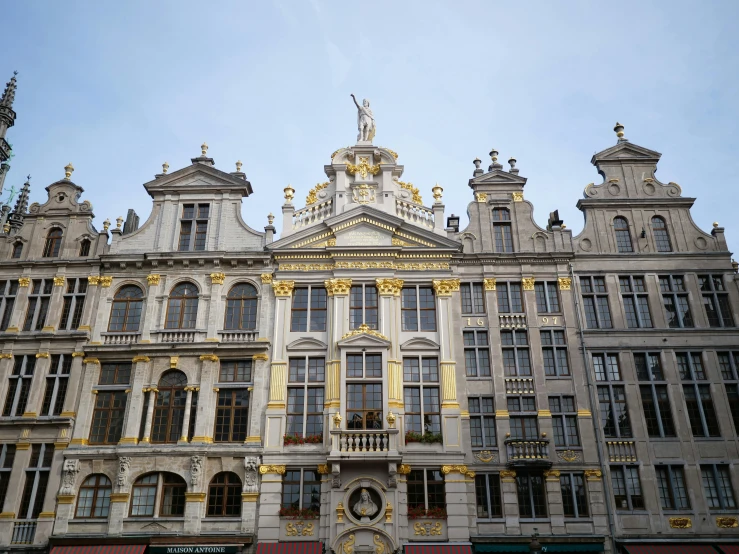 large buildings are decorated in ornate gold and white