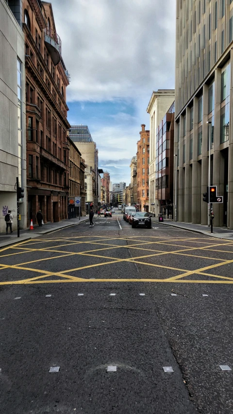 street intersection near several buildings and buildings under cloudy skies