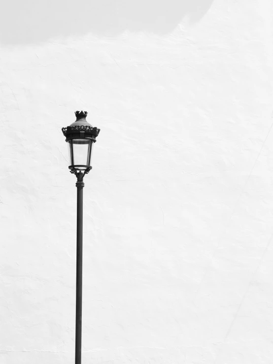 a street light is on a dark pole