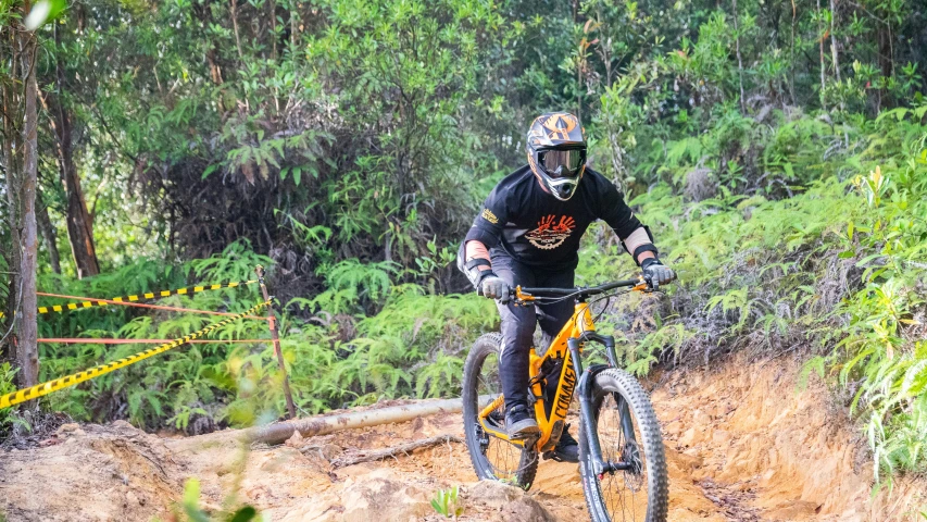 a man is on his mountain bike in the mud