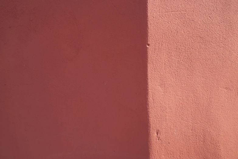 a red wall with some sort of pattern on it