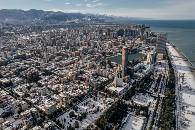 a big city on the shore with snow