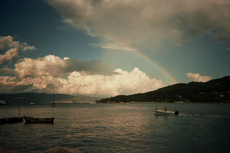 a person riding in a boat near the shore