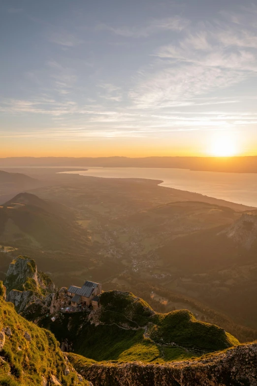 sunset at top of mountain looking down on bay