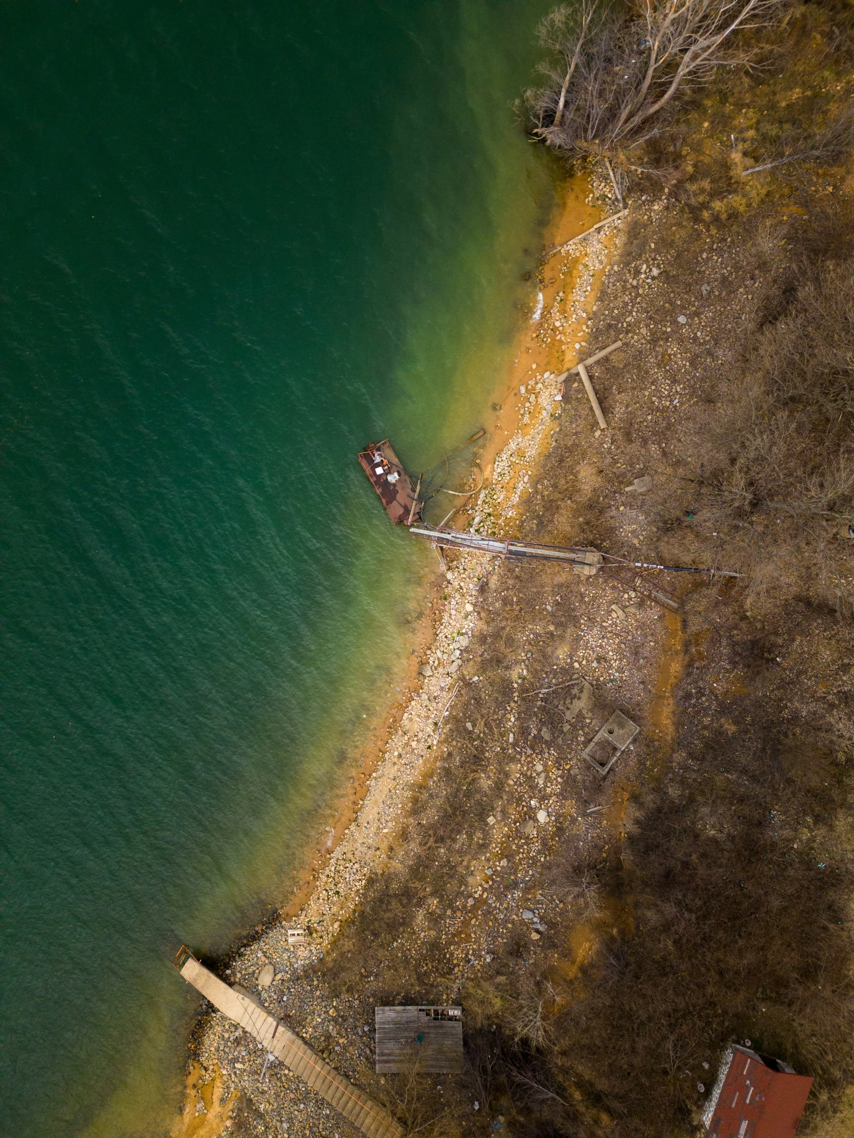 aerial view of two boats parked on lake shore