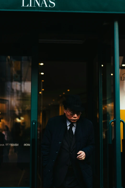 a man in a suit entering a building