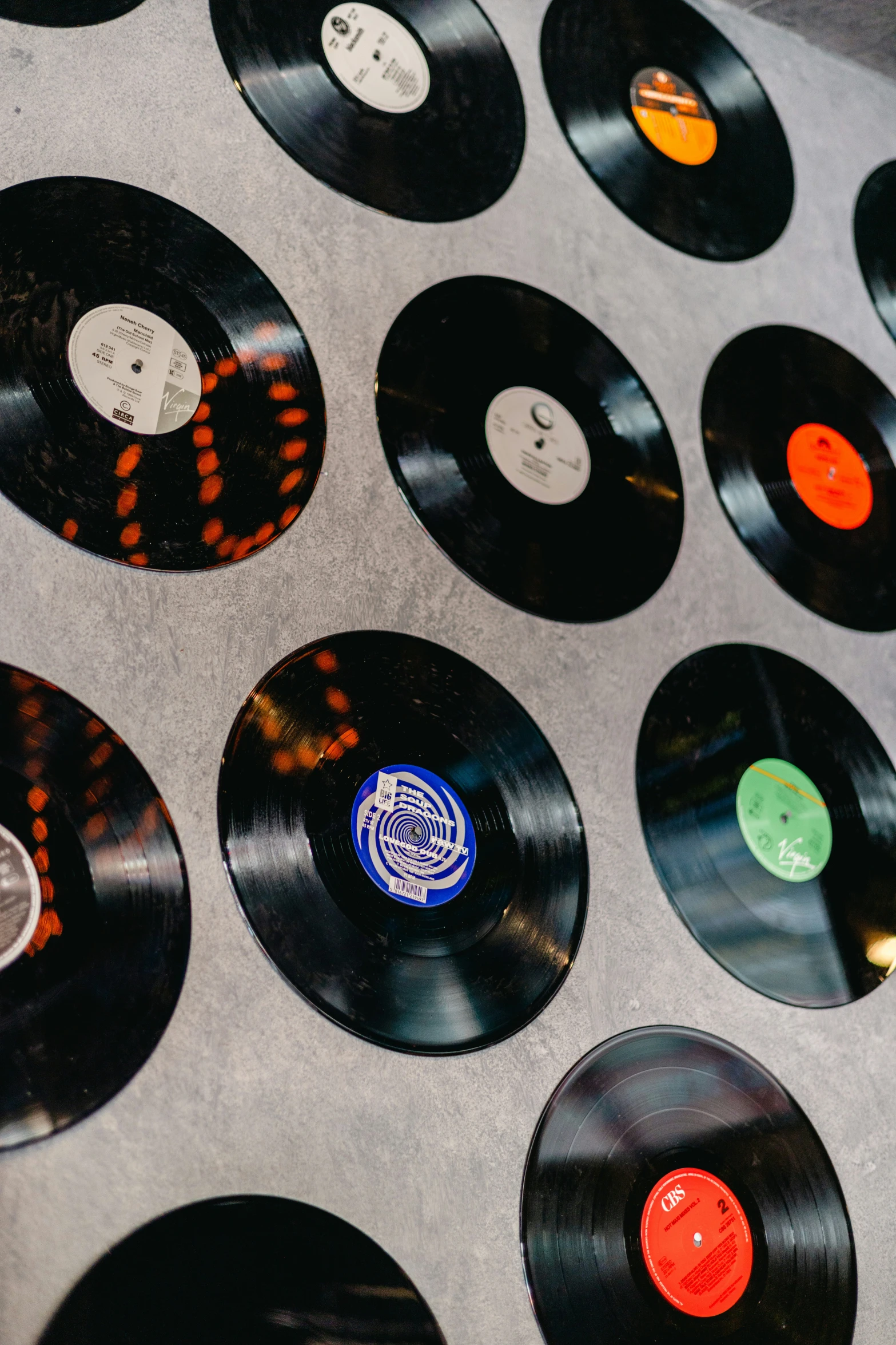 a number of records on a table with some on a surface