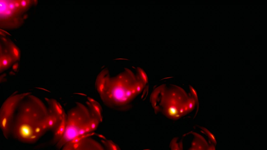 a group of red balls in the dark