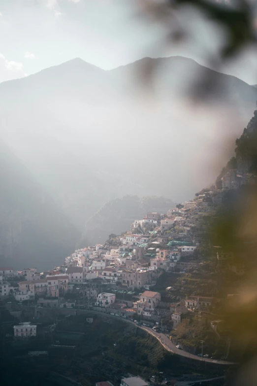 a small village on top of a hill in the mountains