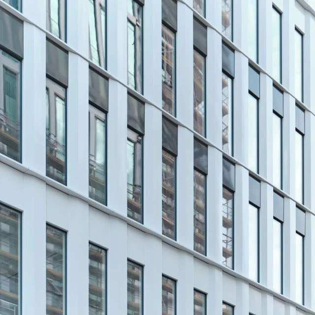 the facade of an office building with many windows