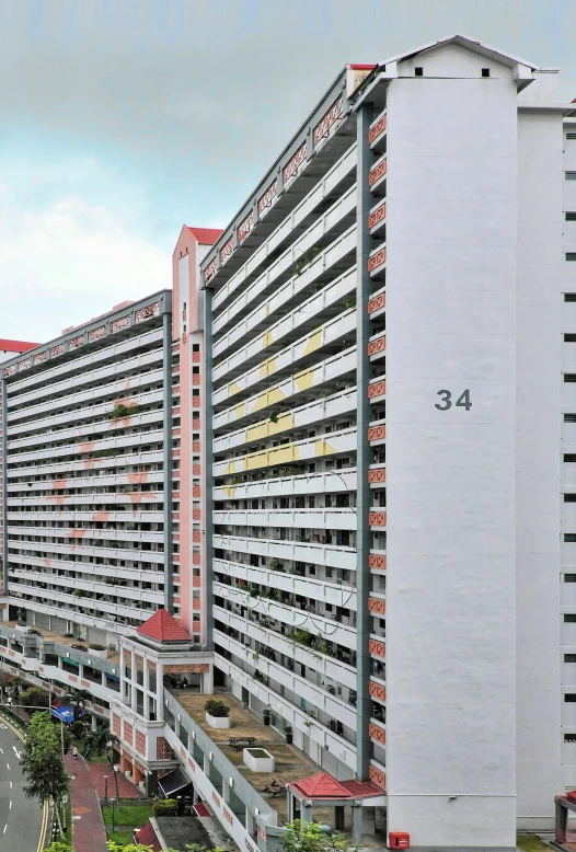 a long road lined with multiple tall buildings