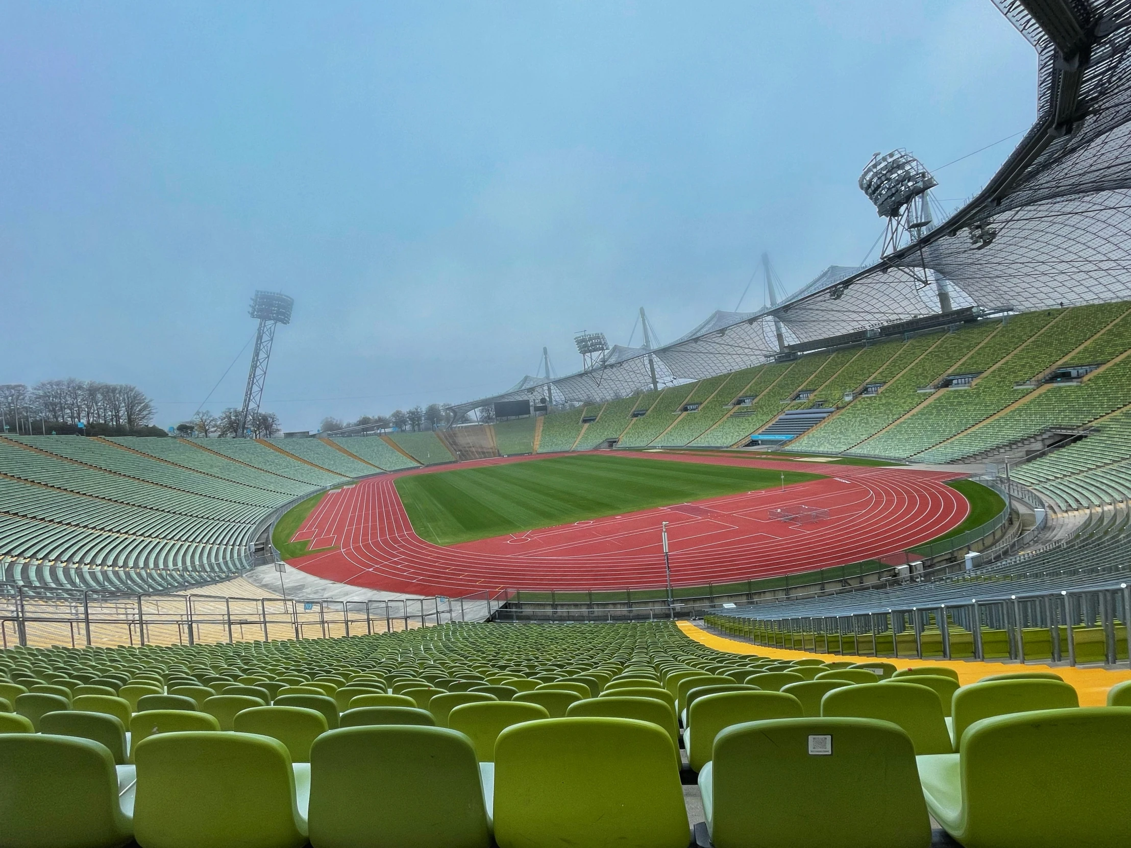 rows of seats at the end of an empty stadium